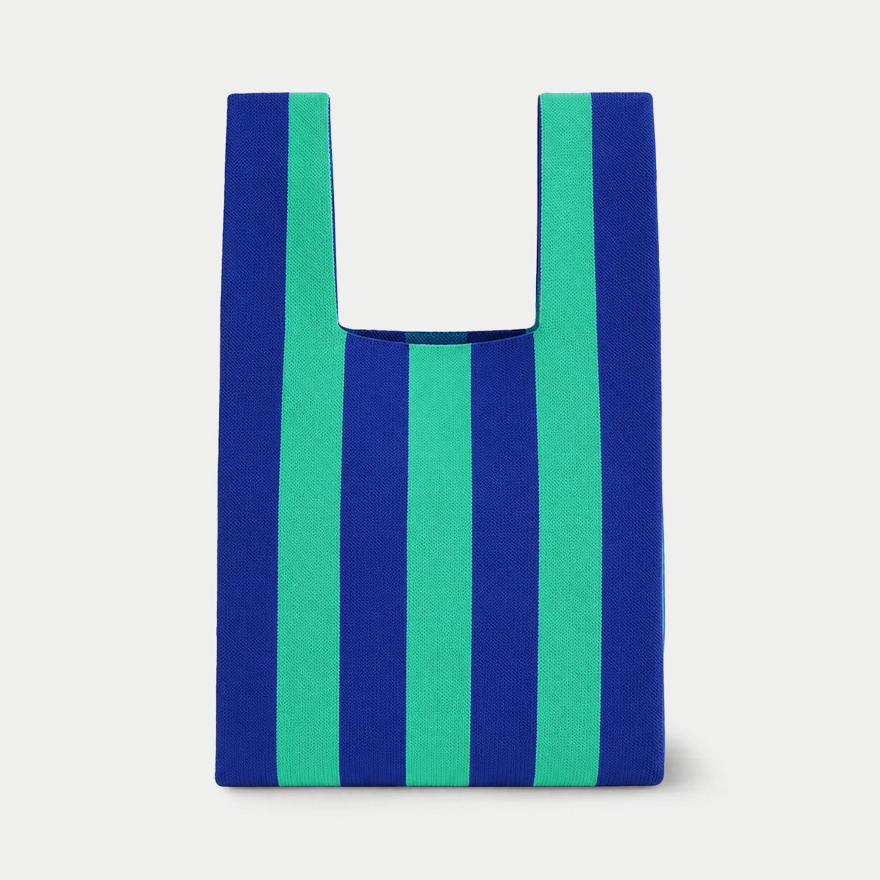 Blue and green vertical stripe knitted tote bag featuring a bold striped design, a lightweight everyday bag made from recycled polyester yarn.