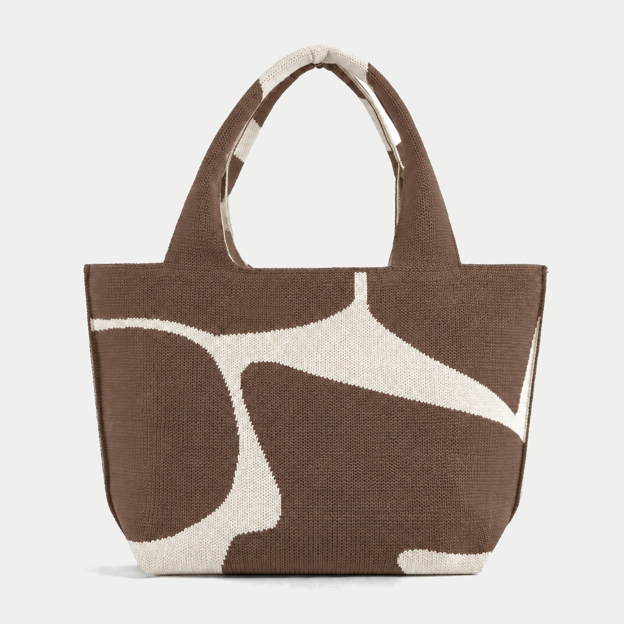Brown abstract flow pattern knit large tote bag with an oversized cream graphic and integrated knit handles by Tokeii.