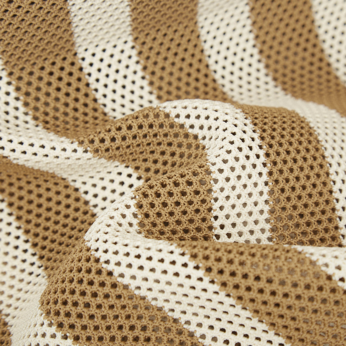 Close-up texture view of camel beige and white striped mesh knit tote bag featuring the open knit pattern and lightweight construction.