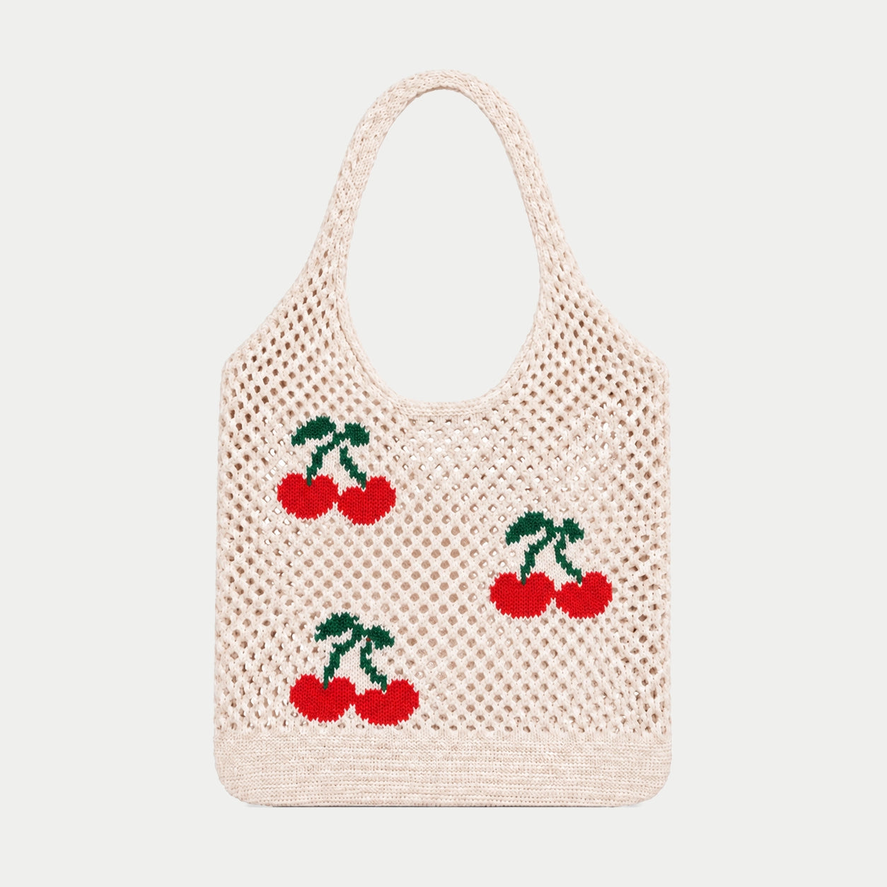Cream open knit tote bag with red cherry motifs and green stems, featuring an airy openwork texture and integrated knitted handles by Tokeii.