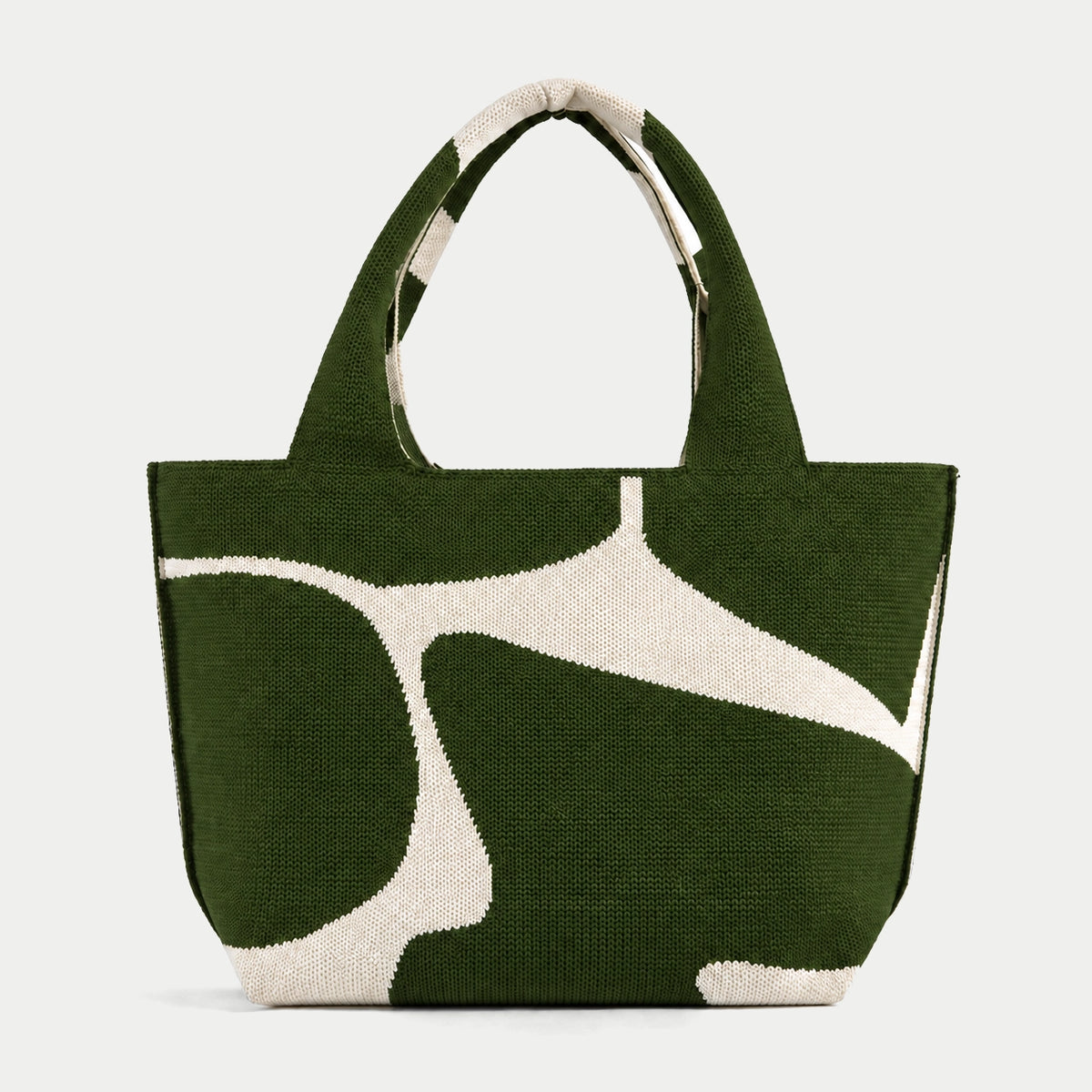 Dark green abstract flow pattern knit large tote bag with an oversized cream graphic and integrated knit handles by Tokeii.