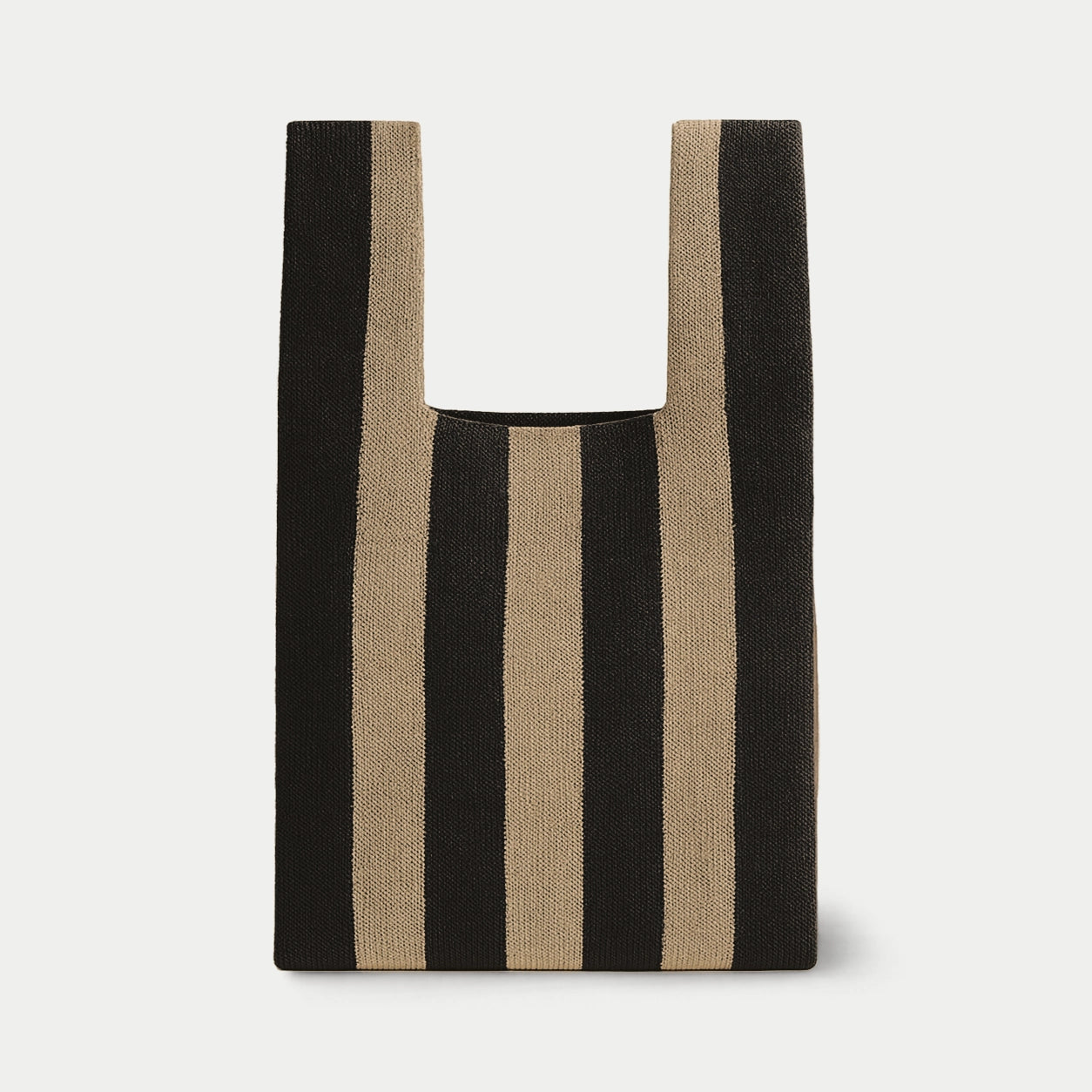 Black and camel vertical stripe knitted tote bag featuring a bold striped design, a lightweight everyday bag made from recycled polyester yarn.