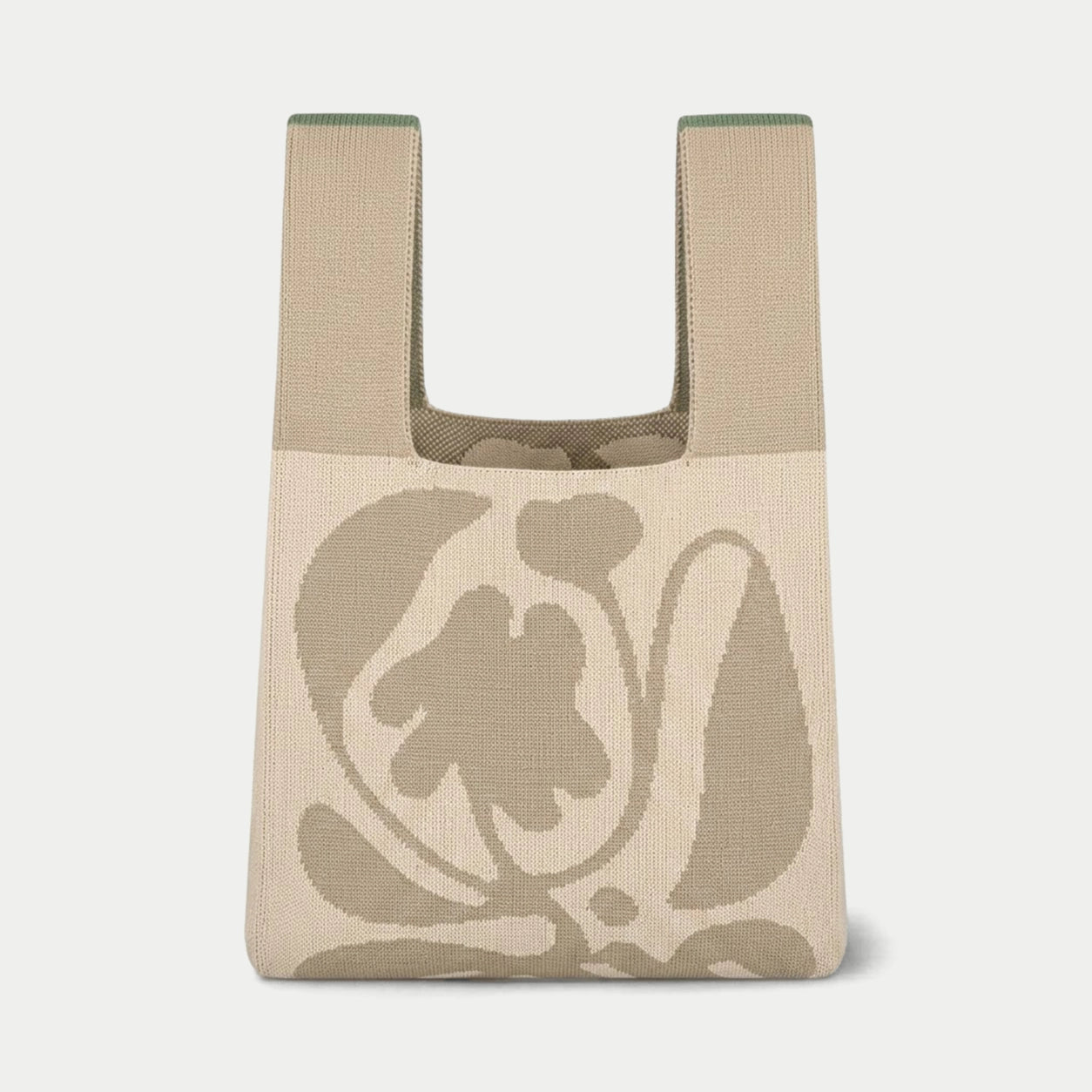 Grey oversized flower knitted tote bag featuring a bold graphic flower design, made from recycled polyester yarn.