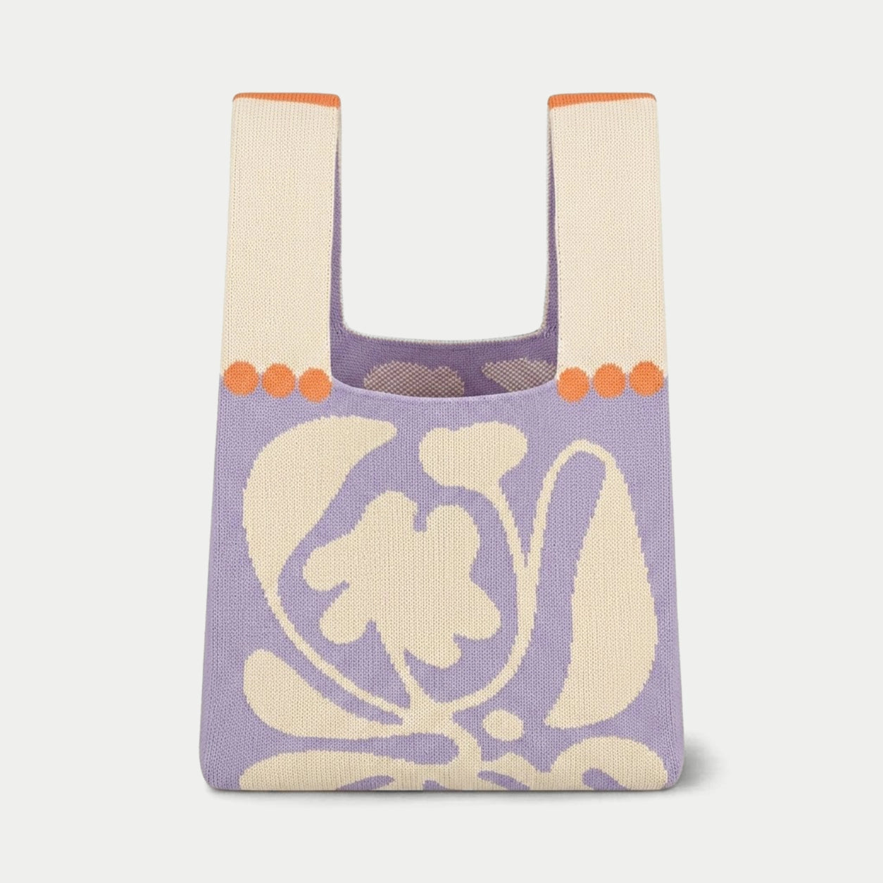 Purple oversized flower knitted tote bag featuring a bold graphic flower design, made from recycled polyester yarn.