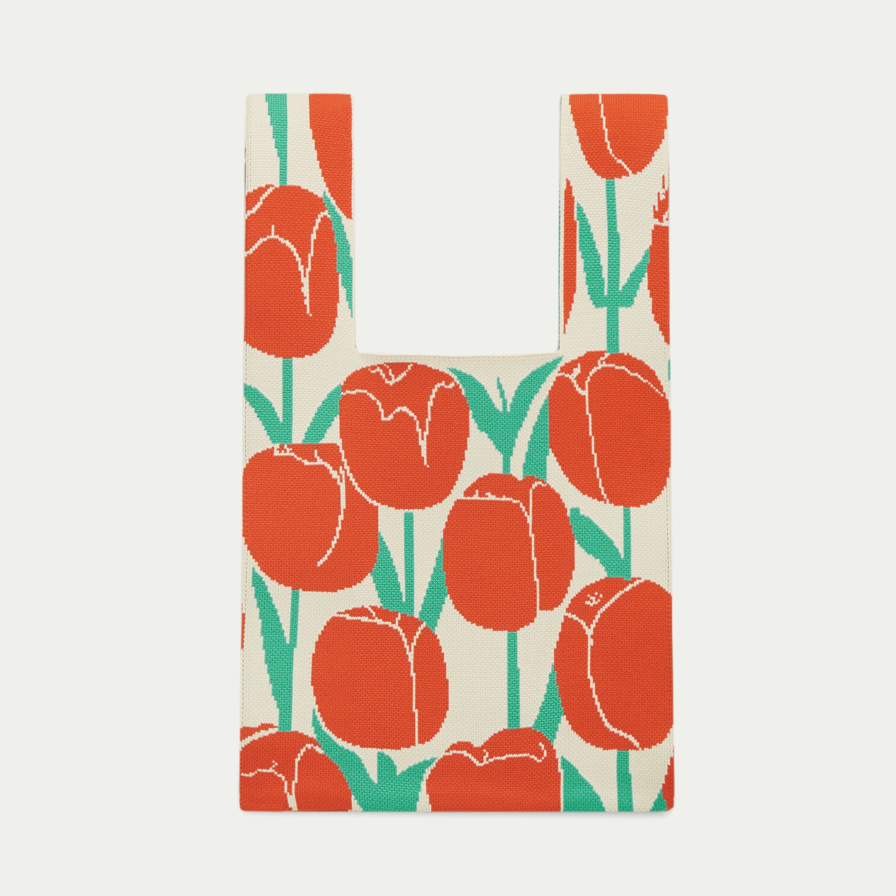 Red, cream and teal tulip pattern knitted tote bag featuring oversized tulip flowers with contrasting stems and leaves, made from recycled polyester yarn by Tokeii.