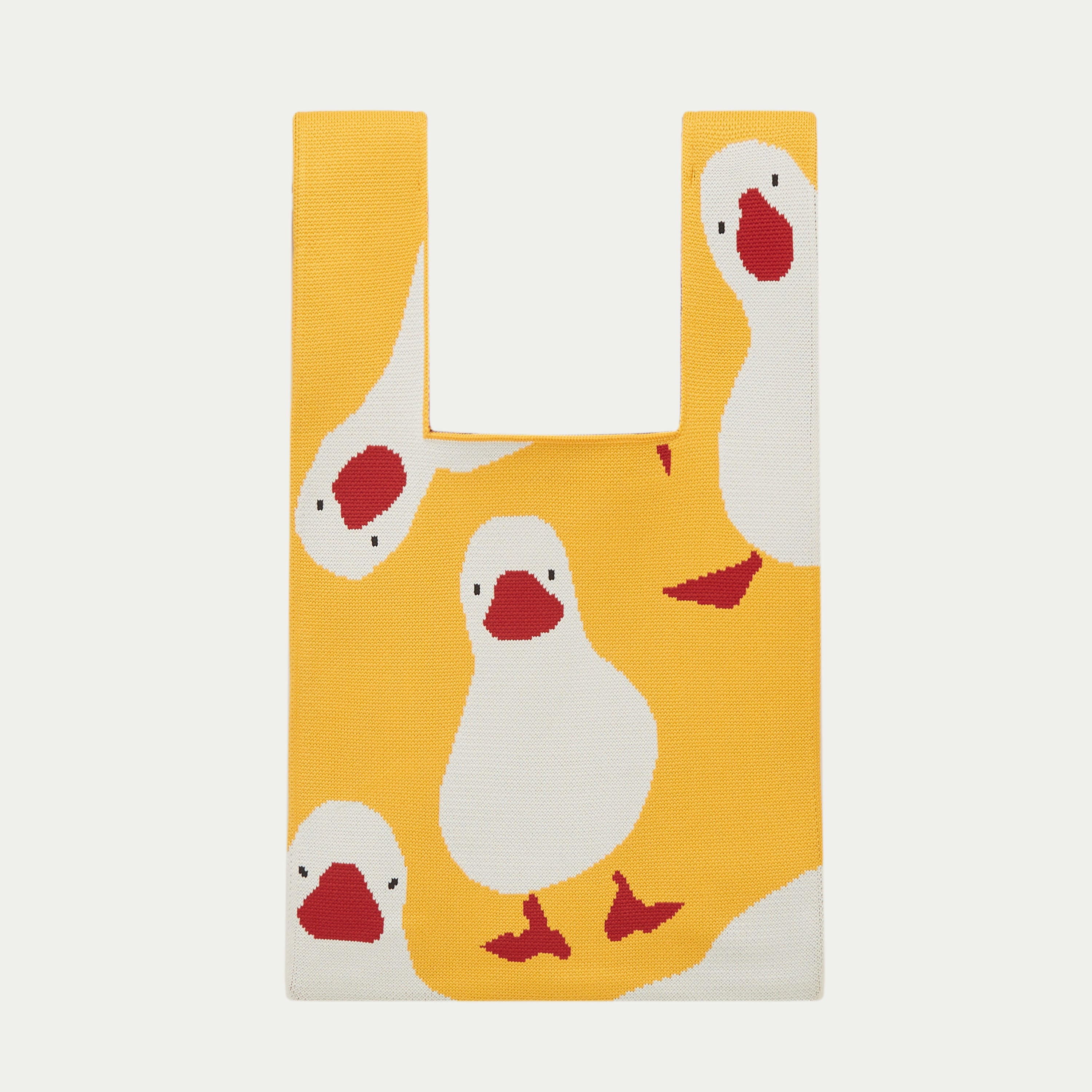 Yellow duck pattern knit tote bag featuring playful white duck motifs with red details on a warm yellow knitted background.