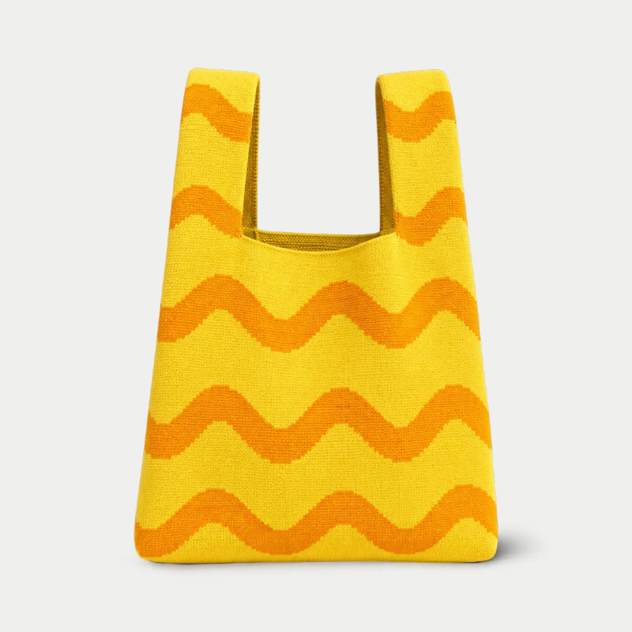 Yellow Wave Pattern Knit Tote Bag with orange wavy stripes and integrated handles, front view.